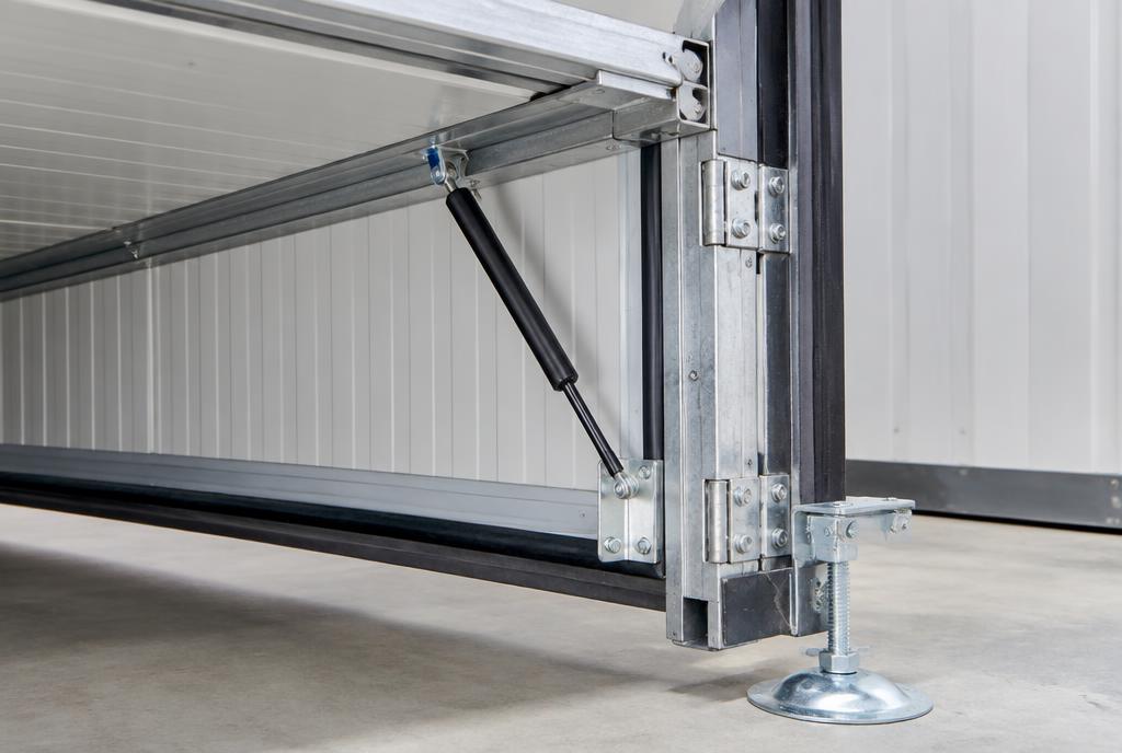 Close-up of the cabin hinge, gas strut and screw-jack leveling foot